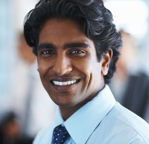 Portrait of a happy business man smiling confidently at work